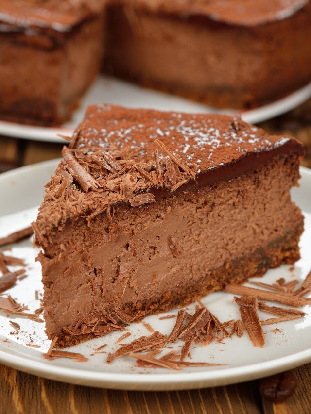 Rich chocolate cheesecake slice with shavings
