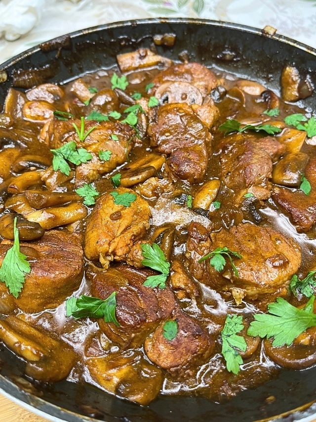 Savory pork medallions in rich sauce
