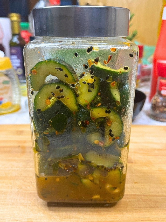 Jar of marinated cucumber slices
