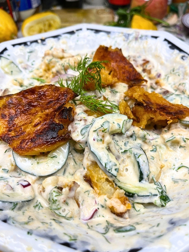 Creamy potato salad with crispy toppings