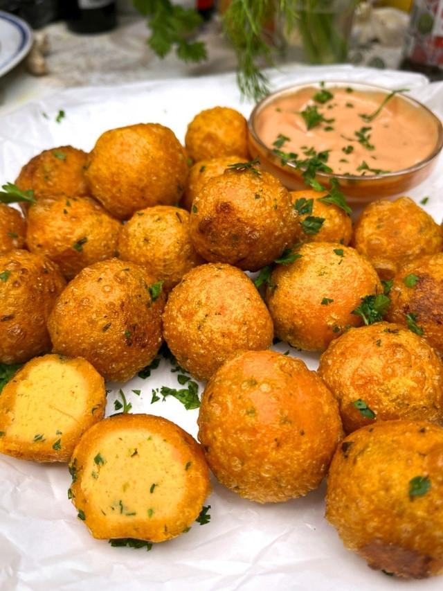 Crispy Sweet Potato Balls on a plate with sauce