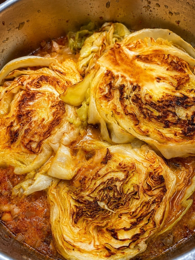 Cabbage Steaks with Creamy Mushroom Sauce in a pan