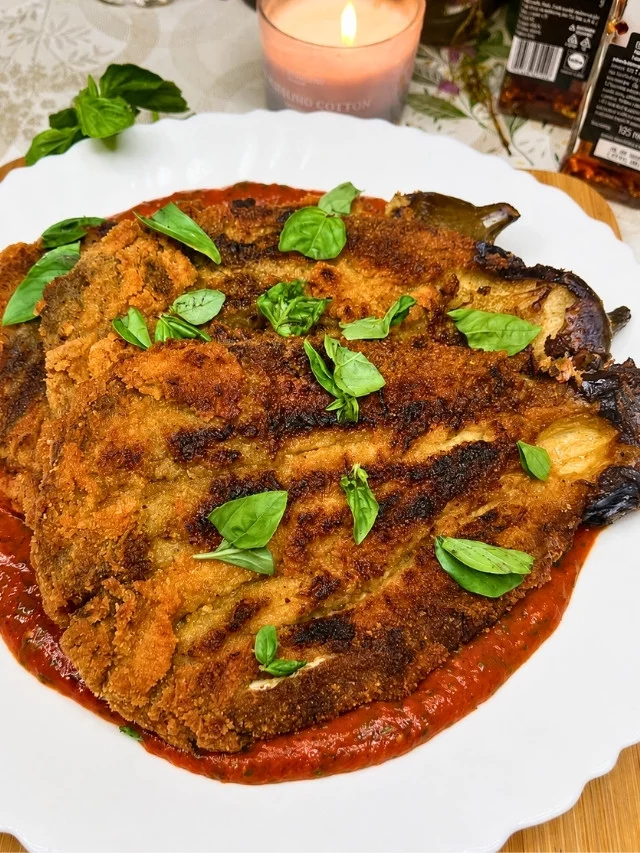 Crispy Eggplant Cutlets with Marinara on a white plate